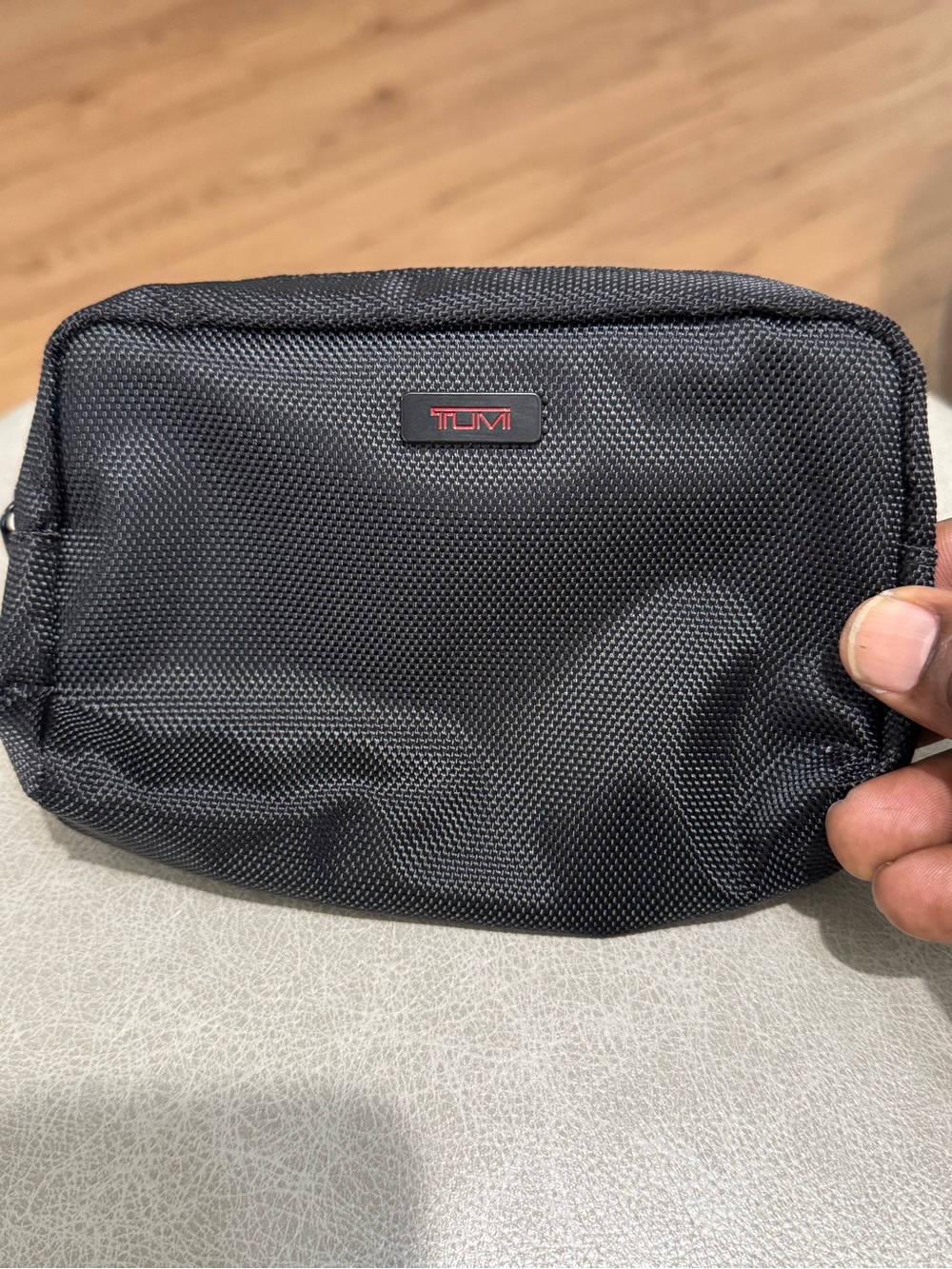 Tumi Black Nylon Toiletry Kit with Red Logo Accent